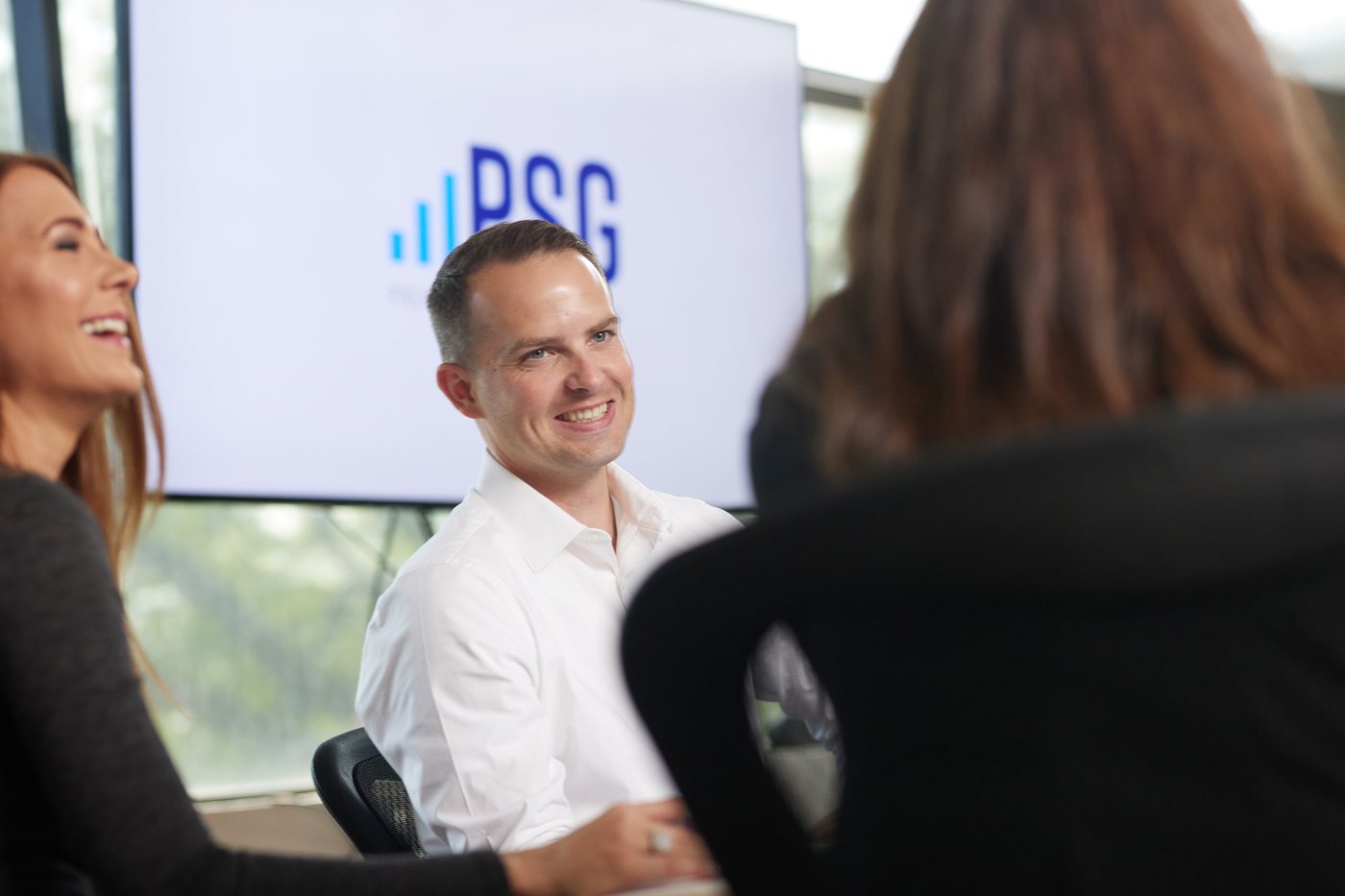 Prenger Solutions Group team members working around a conference table