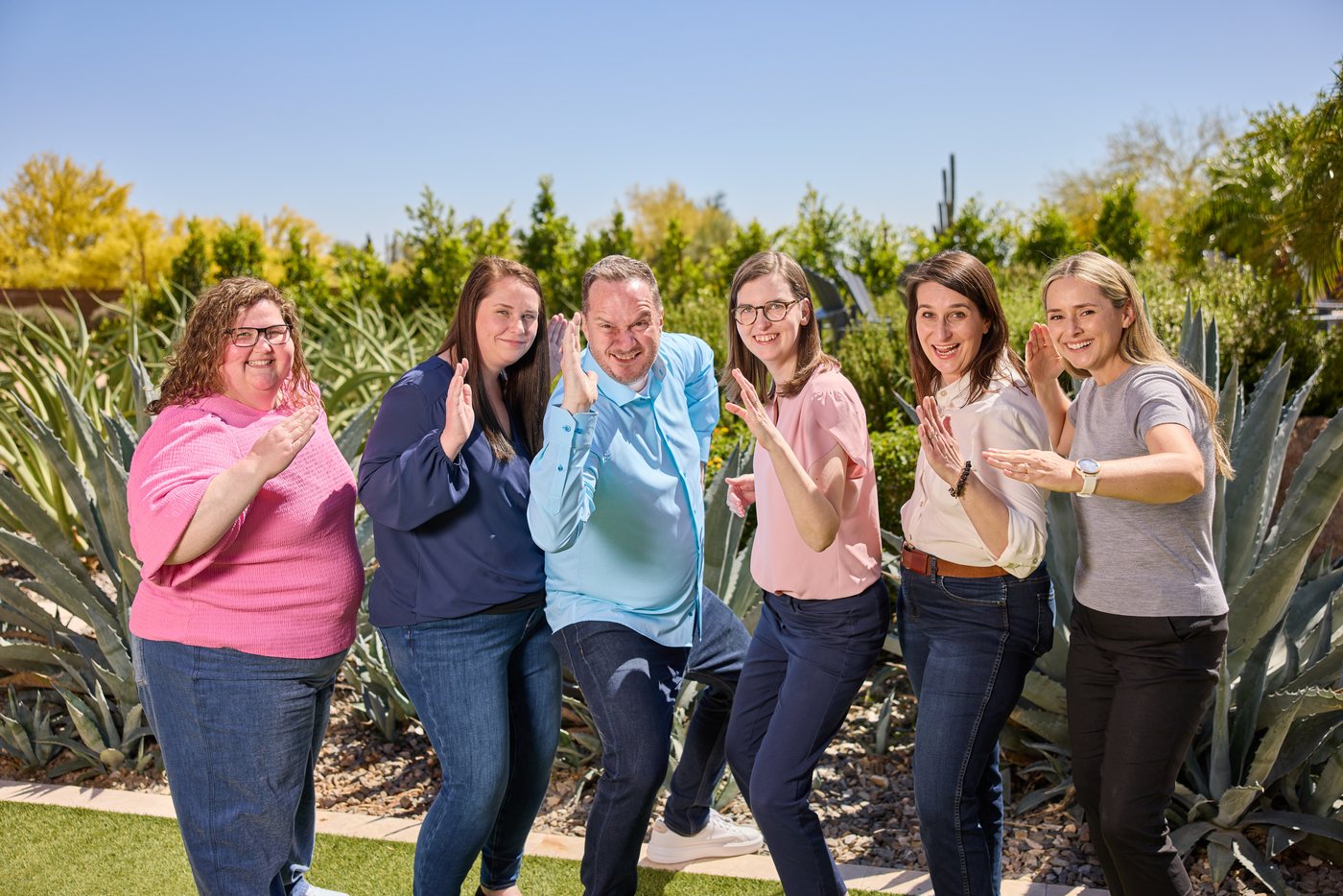 The Prenger Solutions Group team gathered together during a candid team moment