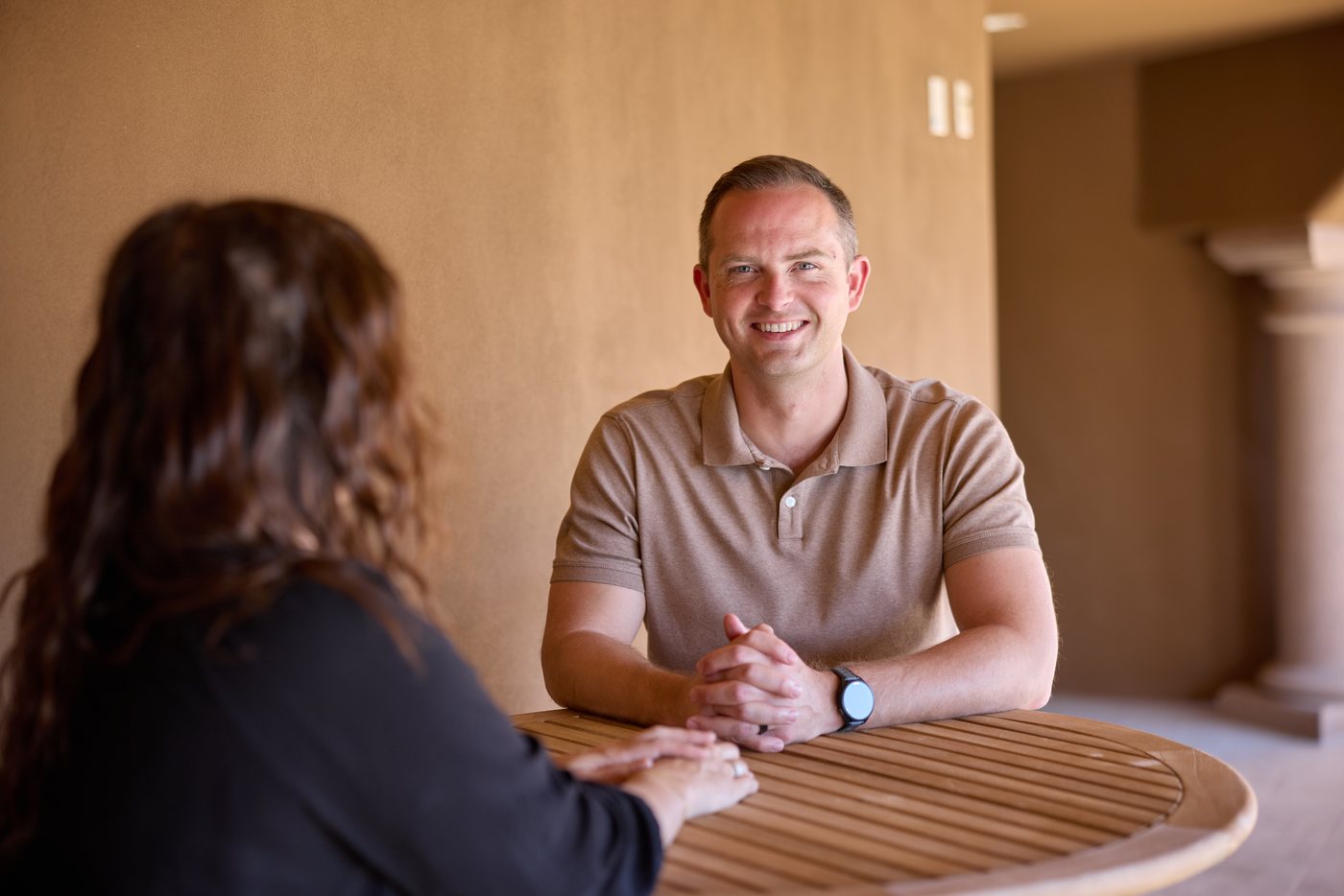 A small group of Prenger Solutions Group consultants in a thoughtful working conversation