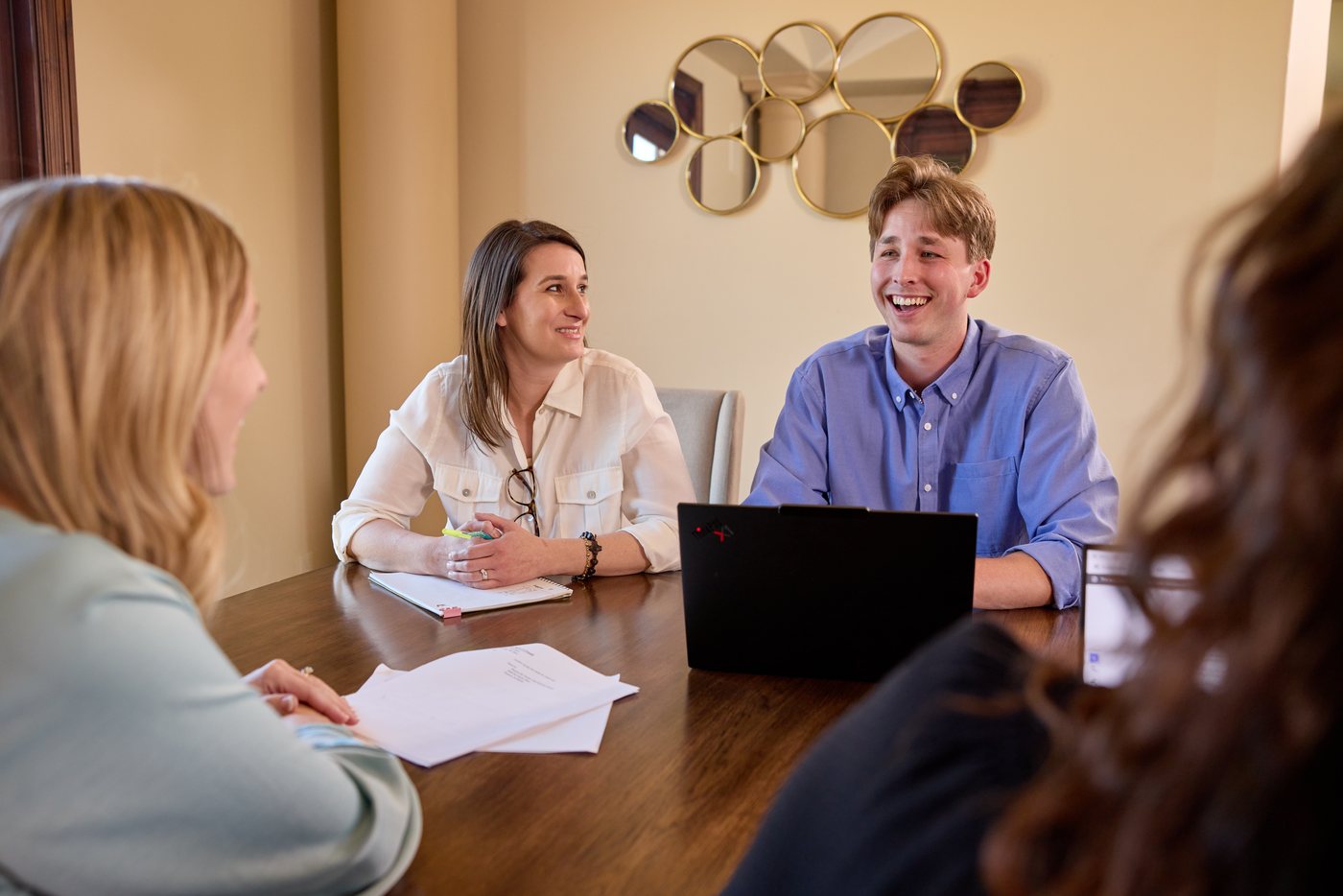 A Prenger Solutions Group working group reviewing acknowledgment materials around a table