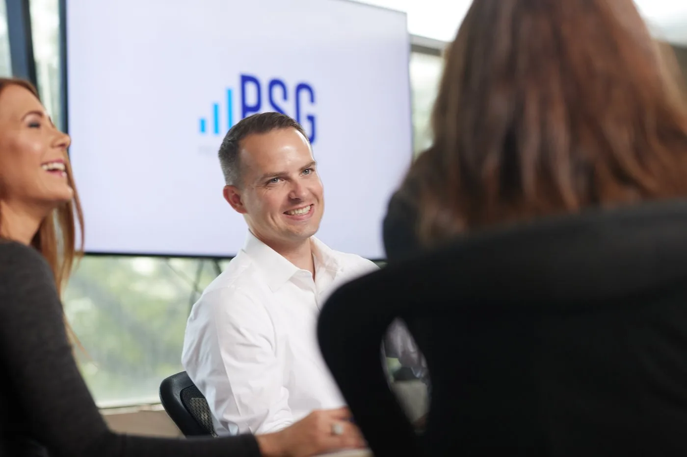 Prenger Solutions Group team members working around a conference table